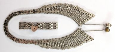 A silver brick and twisted bar section graduated fringe collar necklace, with two acorn like