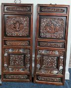 A pair of Chinese carved wooden panels, with pierced foliate decoration and figures carved in