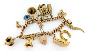 A 9ct gold charm bracelet, set with 14 charms, including slot machine, horseshoe, etc, approx 52g.
