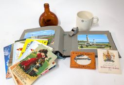 Of GWR interest, a Great Western Railway whistle and mug, together with a postcard album of