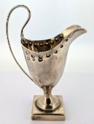 A Victorian silver jug on a square base, hallmarked Birmingham 1897, weight approx 1.85oz.