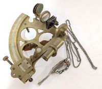 A brass sextant with wooden handle, together with a bosun's whistle on a metal chain engraved '