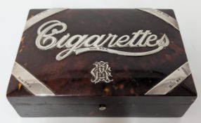 A tortoiseshell and silver cigarette box hallmarked Chester 1895, with fitted wood interior.