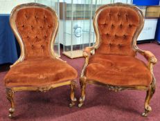 A pair of Victorian 'spoon back' and upholstered parlour chairs, with mahogany 'show wood' frames,