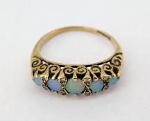A five stone opal and diamond set ring, set in 9ct yellow gold, size N/O, approx 2.5g.