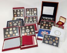 A collection of year sets from 1999 to 2006 in red royal mint cases with others including