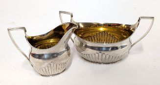A silver milk jug and sugar bowl, hallmarked London 1882, total weight approx. 8.25oz.