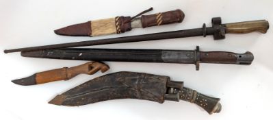 Two bayonets, together with a collection of African knives.