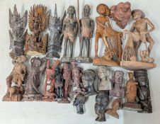 A collection of carved wooden figures, to include a pair of Chinese net makers, Buddhist figures,