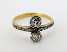 A diamond two stone 'Toi Et Moi' (You and Me) set ring, set in yellow gold (not hallmarked), size P,