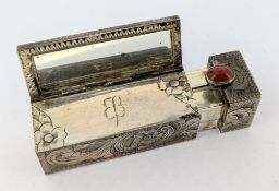 Of WWII German interest, a silver lipstick holder and hinged spring mirror, monogrammed with the