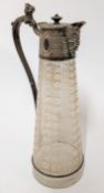 A silver plated and frosted glass decanter, with elaborate engraving to the mount and faces to