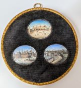 A set of three painted miniatures of Indian scenes in a fabric and gilt frame, diameter approx.