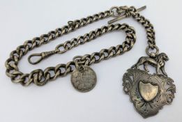 A silver albert watch chain with a fob attached and a silver six pence coin dated 1895.