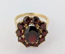 A garnet set dress ring, set in 14ct yellow gold, approx 4.4g, size N/O.