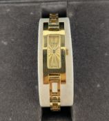Gucci, a ladies gold plated quartz wristwatch, model 3900L, with box, warranty card dated 16.08.01.