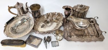 A large collection of silver plated items, to include gravy boat, platters, fish bottle stop, candle