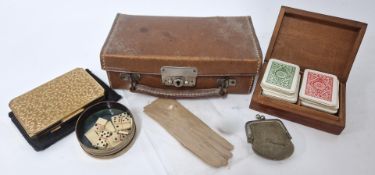 A collection of miniature items to include suitcase, pair of gloves, purse, cased playing card