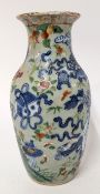 A Chinese celadon ground vase, decorated with fruits, floral motifs, and blue scrolls, tables,