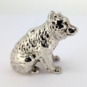 A white metal figurine of a sitting bear, probably silver, early 20th century German, weight approx.