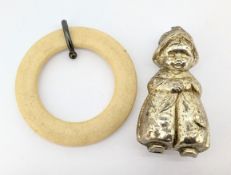 A silver rattle and teether in the form of a traditional Dutch child (broken finial), hallmarked