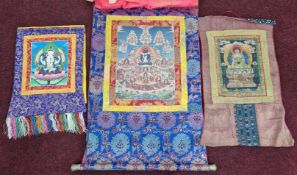 Three Buddhist fabric patterned hangings. (3)