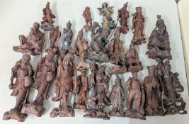 A collection of carved Chinese wood figures.