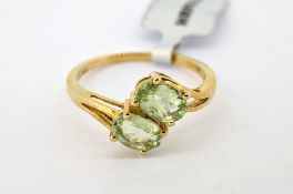 Gemporia, a ultraviolet colour change garnet two stone ring, set in 9ct yellow gold, size R/S,