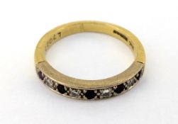 A diamond and ruby half eternity set ring, set in 18ct yellow gold, size N, approx 3.9g.