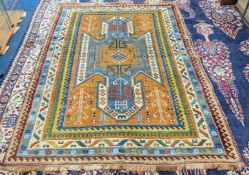 A patterned rug, approx 220cm x 150cm.