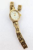 Accurist, a 9ct gold Accurist ladies bracelet watch, oval silver baton dial, cased, with spare