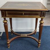 A French style brass inlaid and probably rose wood small desk with satin wood fitted interior and
