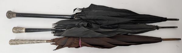 Three silver mounted parasols, two of Indian decoration. (3)