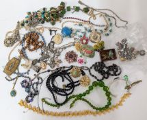 A collection of costume jewellery, to include brooches, beads, earrings, necklaces, thimbles, etc.