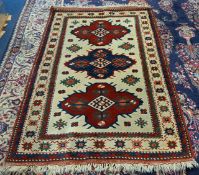A patterned rug, approx 200cm x 130cm.