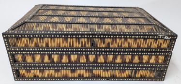 A 19th century porcupine quill writing box, with ivory inlaid pattern, fitted compartments decorated