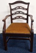 A Victorian mahogany child's chair, with ladder style back and elbow rest, mustard velvet