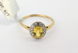 Gemporia, a yellow sapphire and white zircon set ring, set in 9ct yellow gold, size S, with