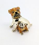 A silver and enamelled Bulldog and Pup, London, CWS, approx 56.9g.