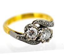 An 18ct yellow gold Toi et Moi diamond crossover ring, size M. Total weight approximately 4.1g.