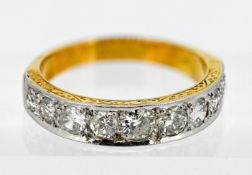 A half band eternity ring, set with nine diamonds in 18ct yellow gold, size O.