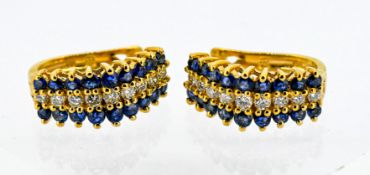 A pair diamond sapphire cluster earrings, set in three rows, in 14k yellow gold, approx 4.6g.