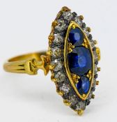 A marquise shaped sapphire and diamond cluster ring, set in 18ct yellow gold, size M/N, approx 5.