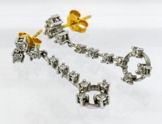 A pair of white gold and diamond drop earrings, with 18ct yellow gold backs. Total weight