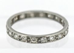 A diamond set full eternity ring, set in white gold (not hallmarked), size N/O, approx 2g.