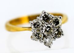 A diamond 'Daisy' style cluster set ring, set in 18ct yellow gold, size L/M, approx 3.9g.