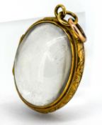 A rare antique rock crystal locket, set in 9ct gold.