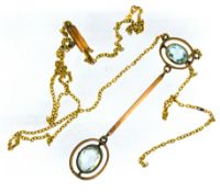 An Edwardian aquamarine drop pendant necklace, set in gold (chain broken).