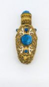 A miniature gilt scent bottle.