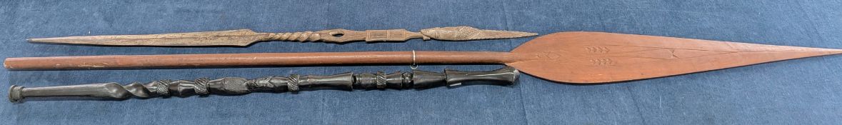 Three carved wooden ethnographica pieces, to include an ebonised staff with carved figure to